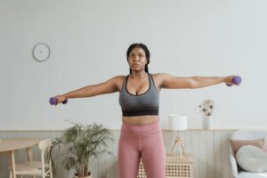 woman exercising with light weights